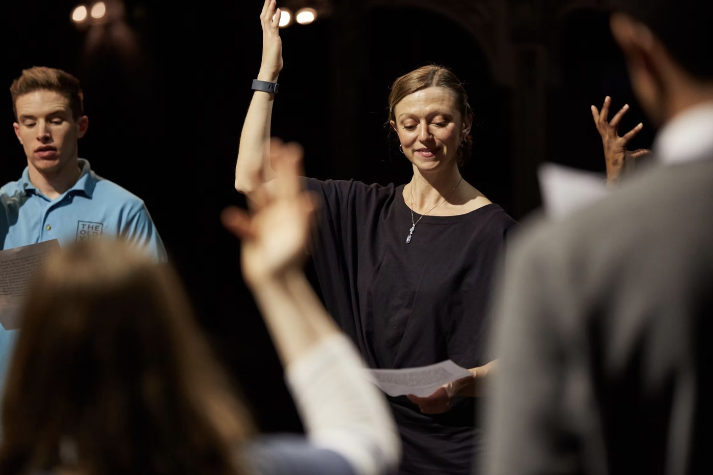 Nia Lynn leading actors in a voice session in rehearsal